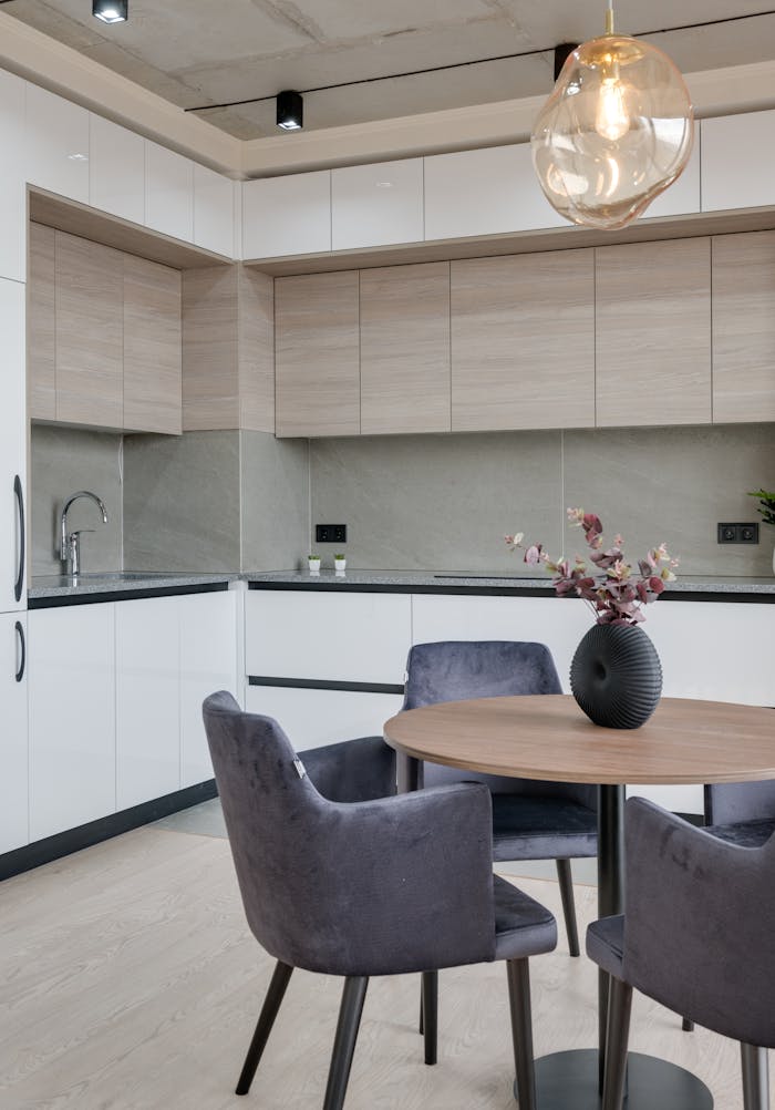 services-05 Contemporary kitchen interior with sleek furniture and stylish lighting in a modern apartment.
